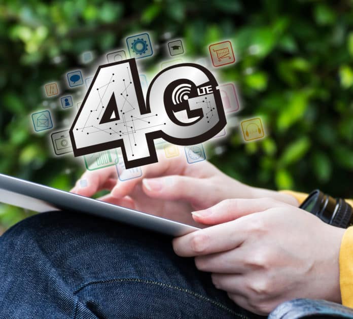 Young woman connecting to 4G by using digital tablet. Myimagine / Shutterstock.com