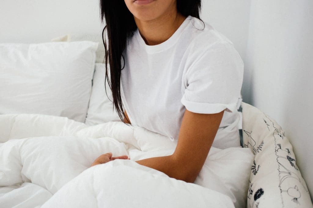 Women sitting on a bed